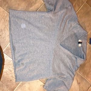 A collared shirt crop top V-neck cute and thrifty